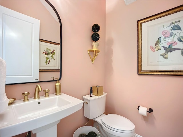 bathroom with sink and toilet