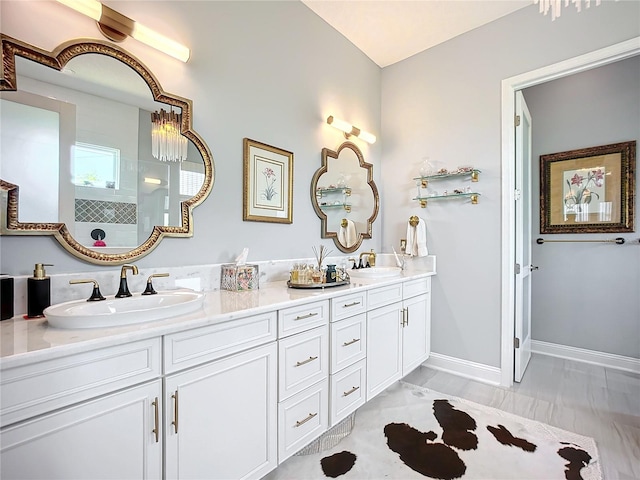 bathroom with a shower and vanity