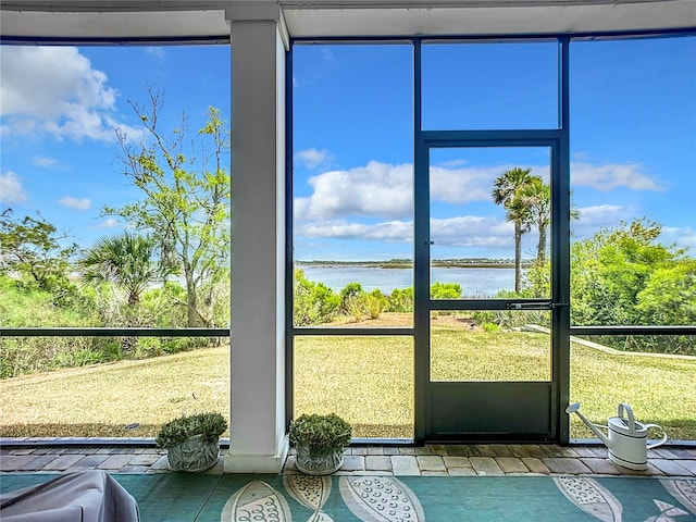 interior space featuring a water view and plenty of natural light