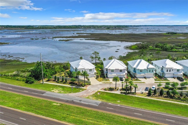 drone / aerial view with a water view