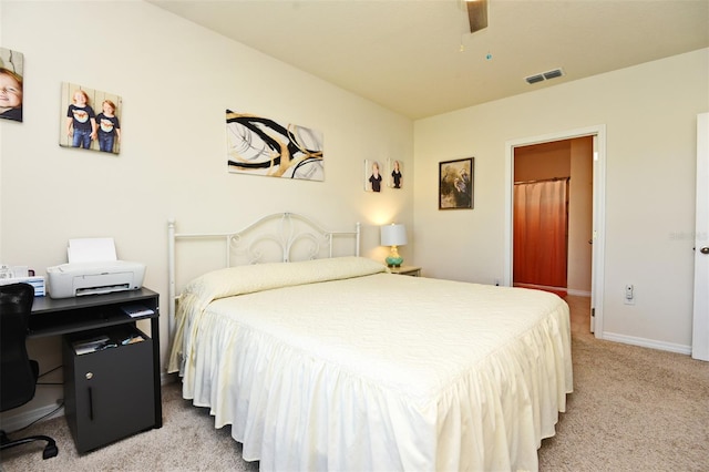 bedroom with ceiling fan and light colored carpet