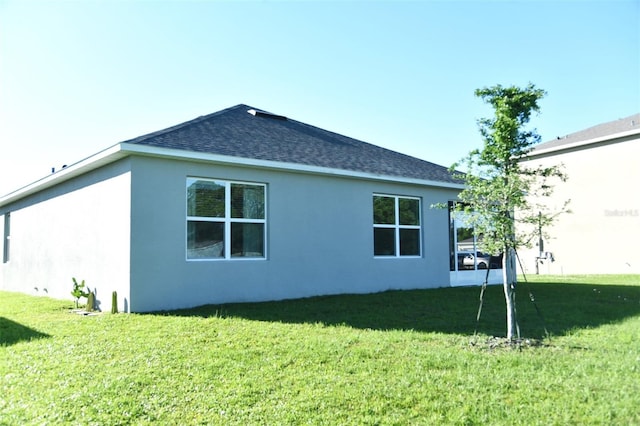 view of home's exterior with a lawn