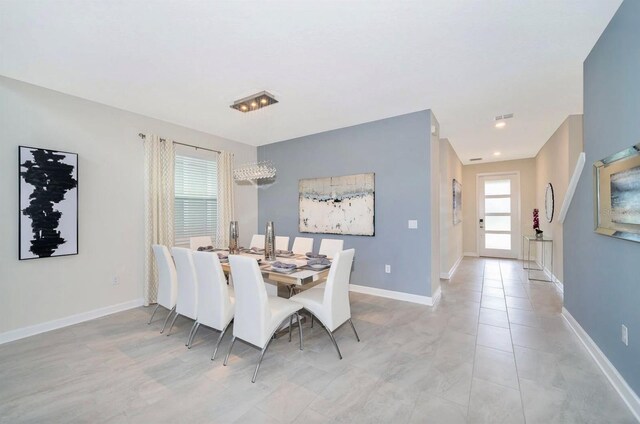 dining space with light tile floors