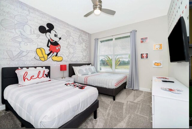 bedroom featuring light carpet and ceiling fan