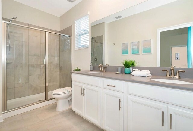 bathroom with walk in shower, toilet, dual vanity, and tile flooring