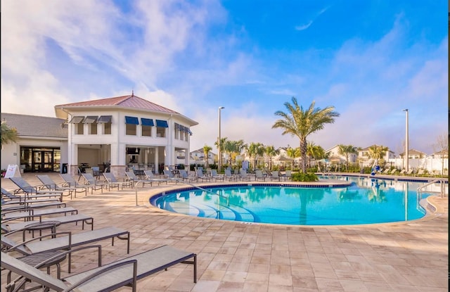 view of swimming pool with a patio