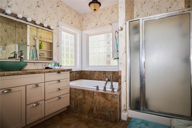 bathroom featuring tile flooring, independent shower and bath, and oversized vanity