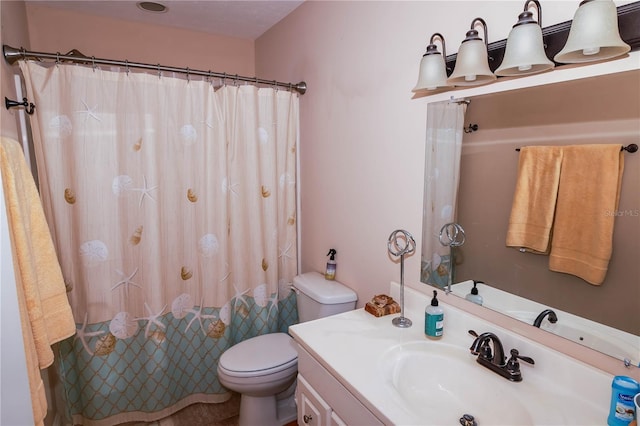 bathroom with toilet and vanity