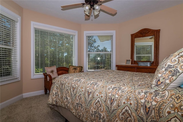 bedroom with dark carpet and ceiling fan