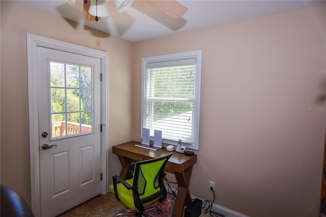 doorway to outside with ceiling fan