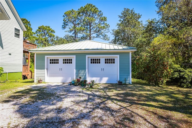 garage with a yard