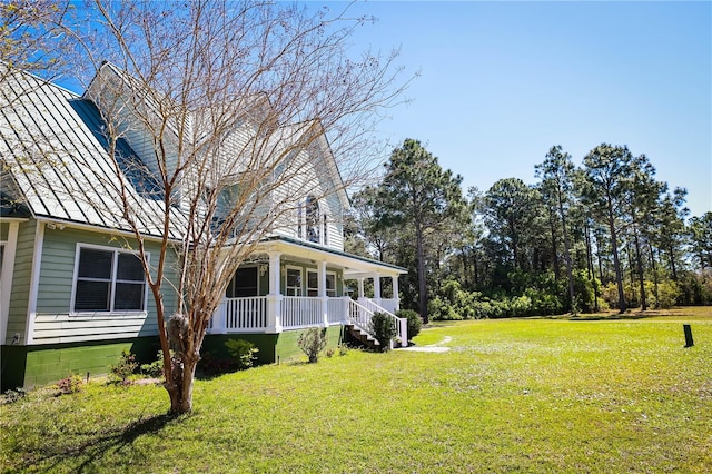 view of yard featuring covered porch