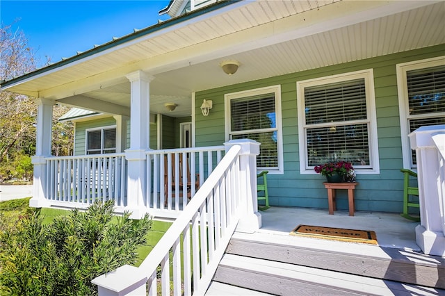 property entrance featuring covered porch