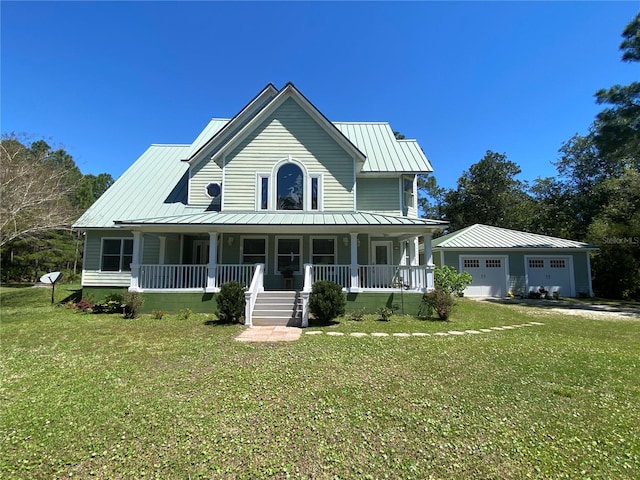 view of front facade with covered porch, a garage, an outdoor structure, and a front yard