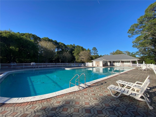 view of swimming pool with a patio