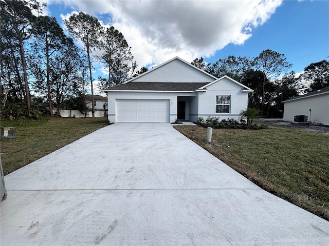 ranch-style house featuring a garage, central air condition unit, and a front yard