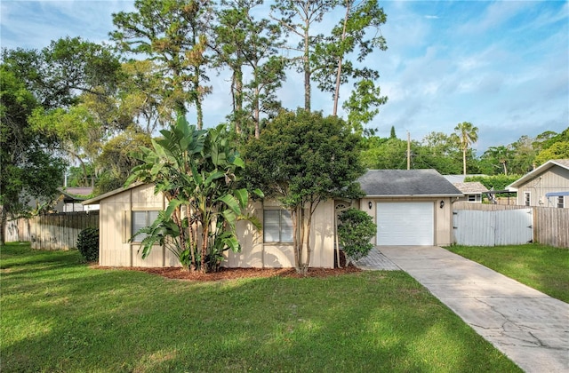 ranch-style home featuring a front lawn and a garage