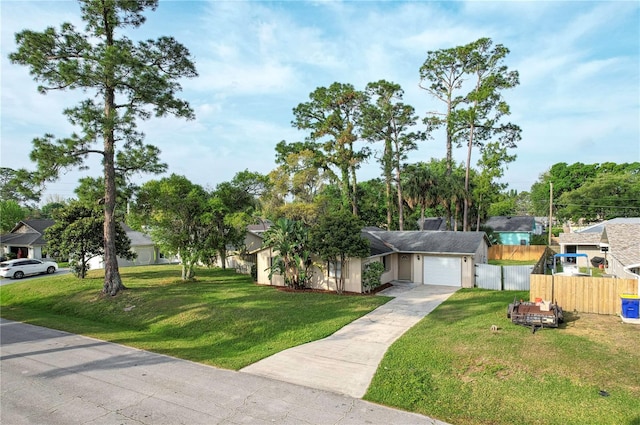 view of front of home featuring a front lawn and a garage