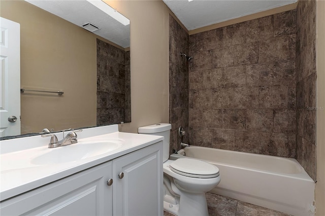 full bathroom featuring tile floors, oversized vanity, toilet, and tiled shower / bath