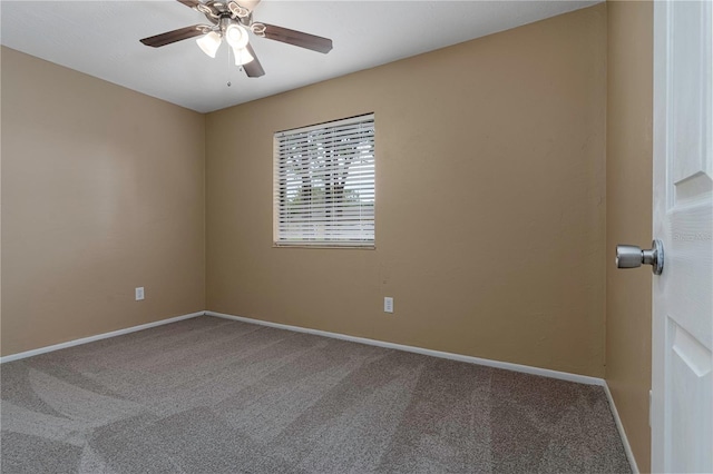 carpeted empty room featuring ceiling fan