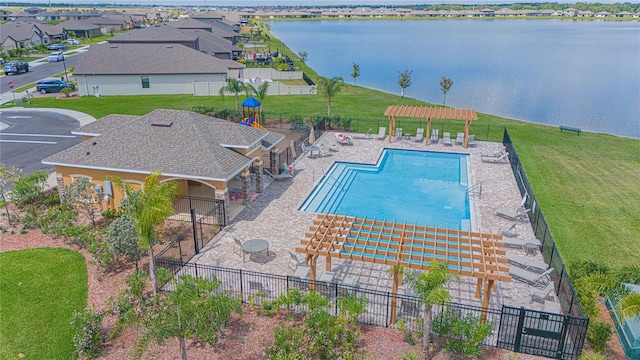 view of swimming pool featuring a pergola, a patio area, and a water view