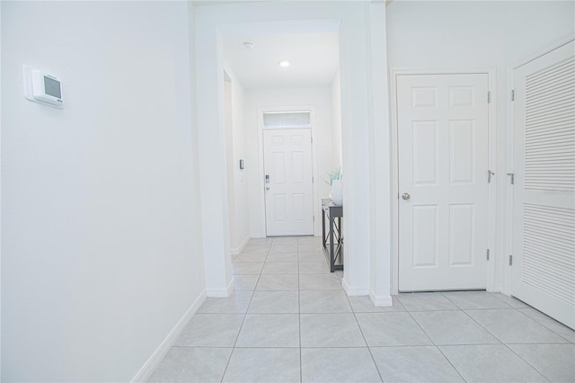 hallway featuring light tile patterned flooring