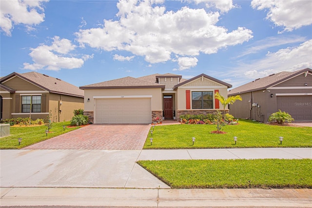 view of front of property featuring a garage and a front lawn