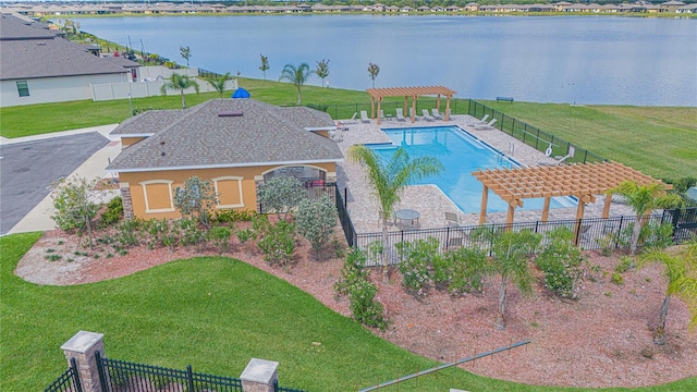 view of pool with a pergola, a water view, and a lawn