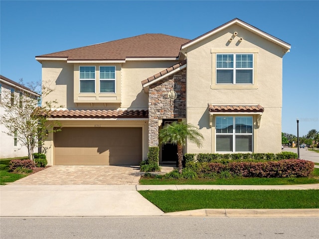 mediterranean / spanish-style house featuring a garage