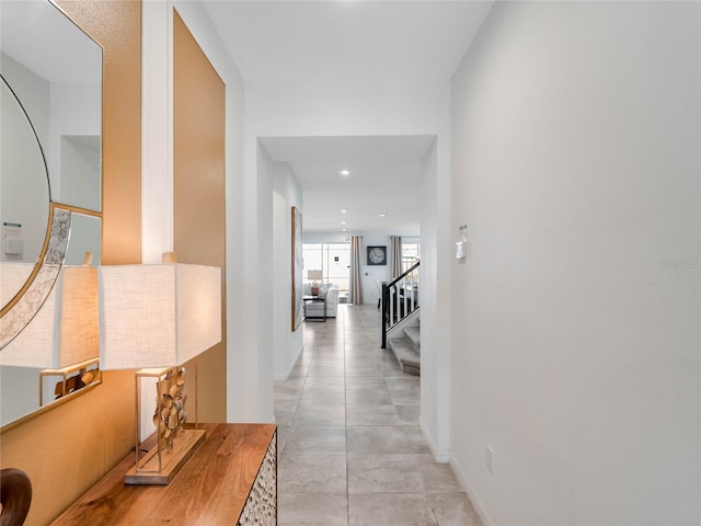 corridor featuring light tile floors