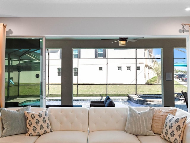 sunroom with ceiling fan and a wealth of natural light