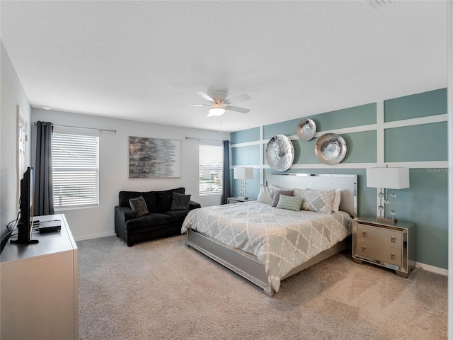 bedroom with light carpet and ceiling fan