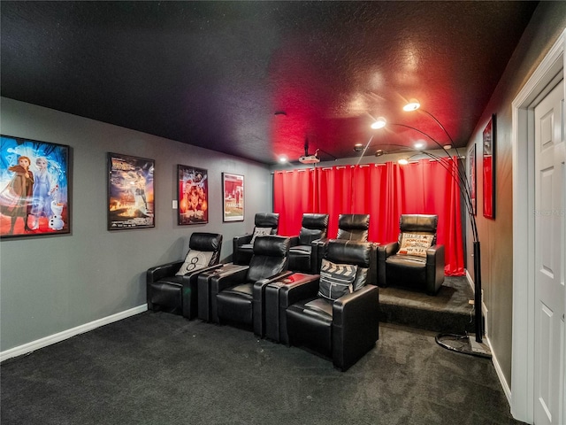 carpeted home theater featuring ceiling fan