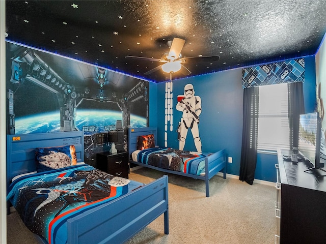 bedroom featuring light carpet, ceiling fan, and a textured ceiling