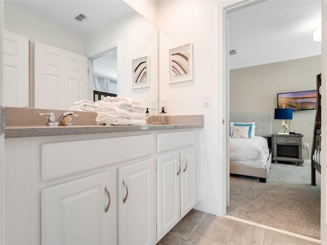 bathroom featuring tile flooring and oversized vanity