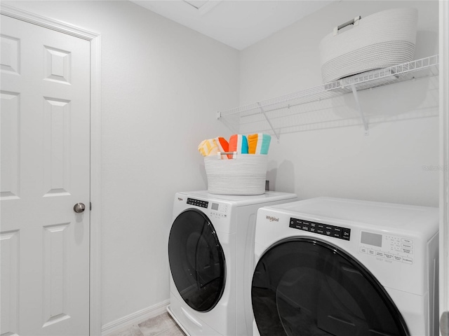 laundry room with washer and dryer