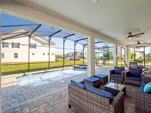 sunroom featuring ceiling fan