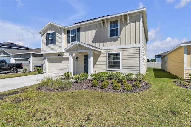 view of front of home featuring a front yard and a garage