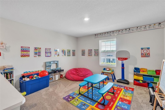 game room with carpet and a textured ceiling