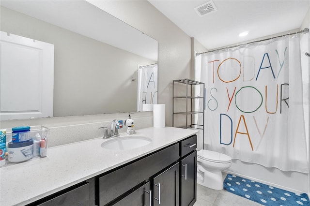 full bathroom with shower / tub combo with curtain, tile floors, toilet, and vanity