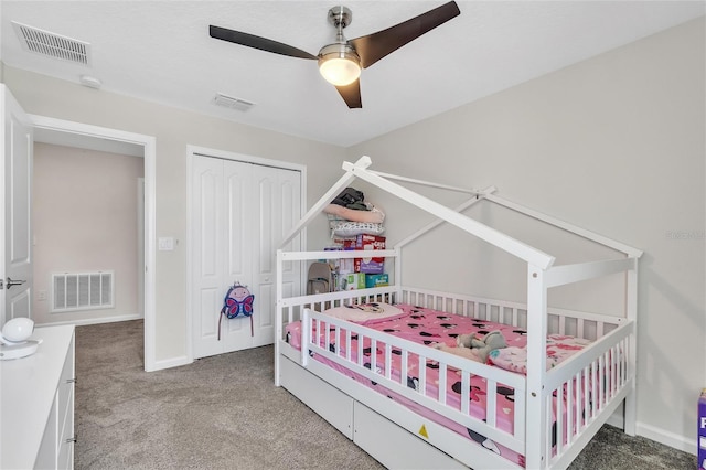 carpeted bedroom with a closet and ceiling fan