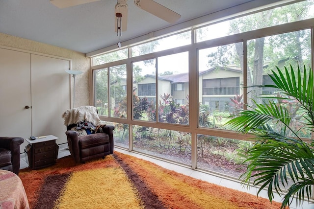 sunroom / solarium with ceiling fan and a wealth of natural light