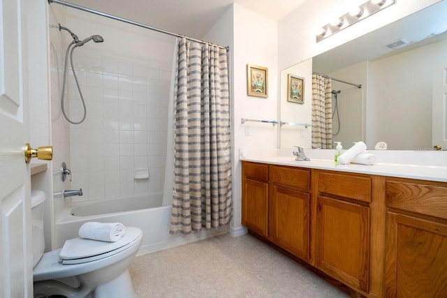 full bathroom featuring vanity, shower / tub combo, and toilet