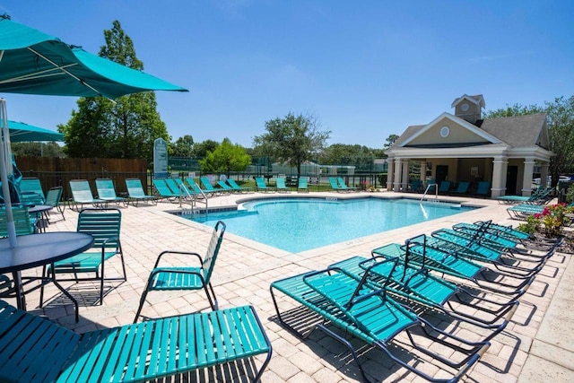 view of swimming pool with a patio area