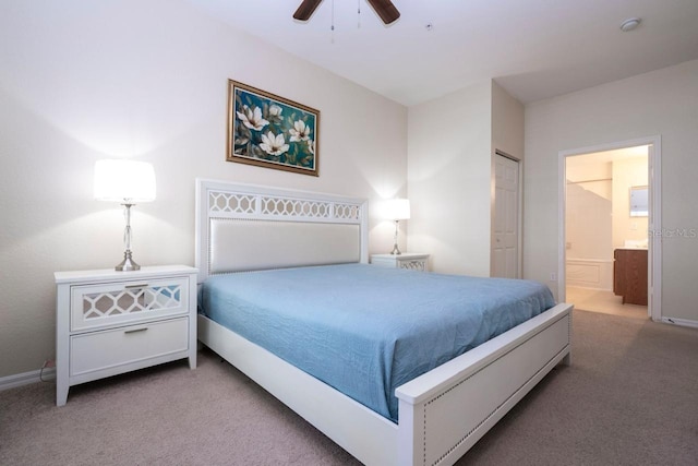 bedroom with light carpet, ensuite bath, a closet, and ceiling fan