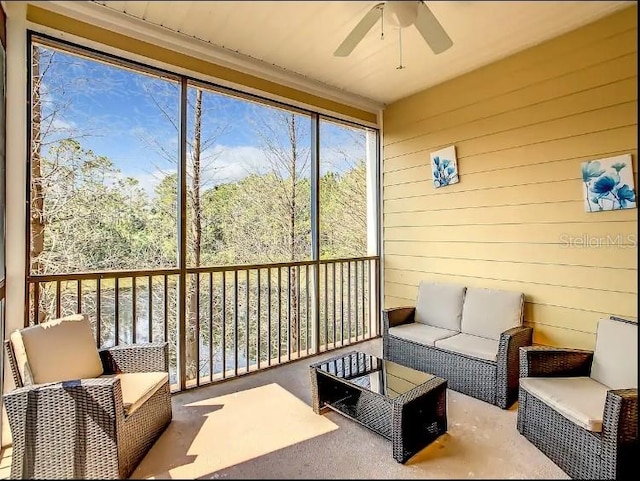 sunroom / solarium with ceiling fan