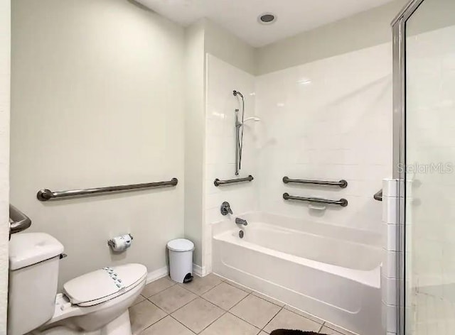 bathroom with toilet and tile floors