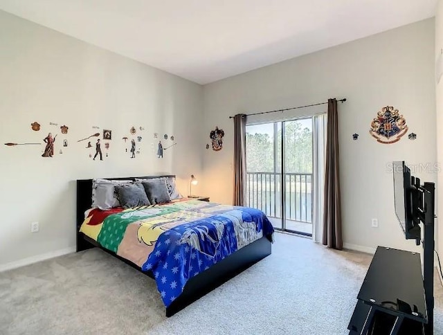 carpeted bedroom featuring access to outside