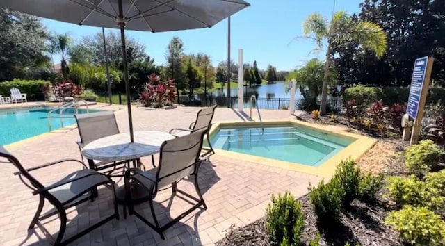 view of swimming pool with a patio area