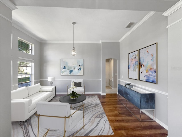 living room featuring dark hardwood / wood-style floors and ornamental molding